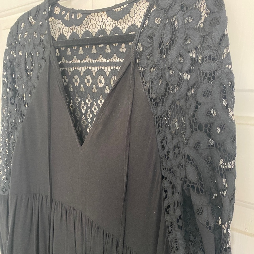 Maksa black lace-back & sleeve dress. Bottom is lined. Loose, comfortable shape